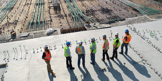 Construction workers having a safety meeting on site